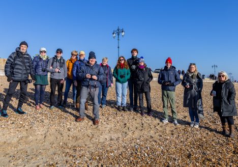 Group of photographers finishing up the walkshop on Southsea beach