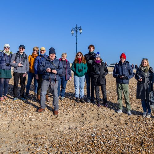 Group of photographers finishing up the walkshop on Southsea beach