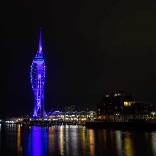 The Spinnaker Tower glows purple at night